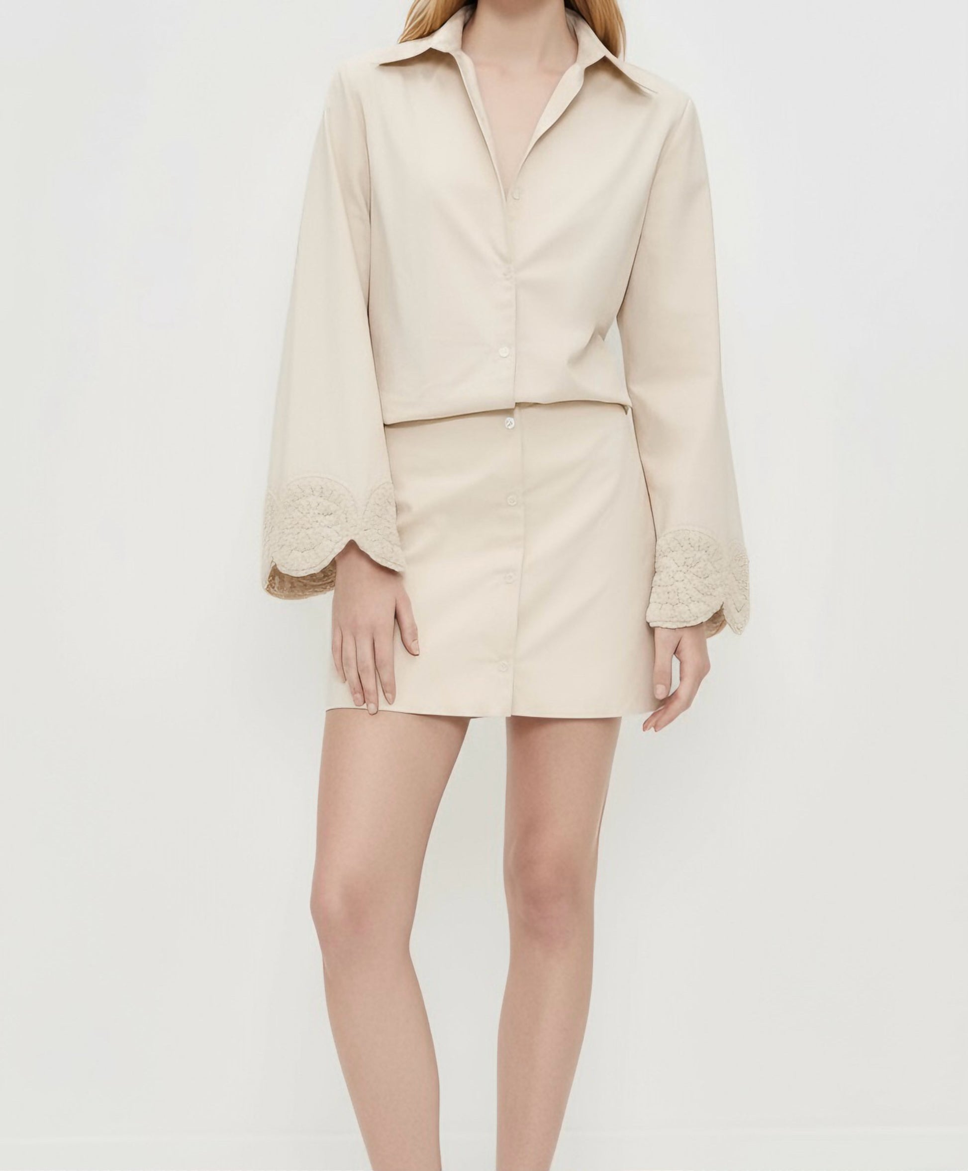 Elegant cream collared mini dress featuring wide sleeves with scalloped crochet detailing.