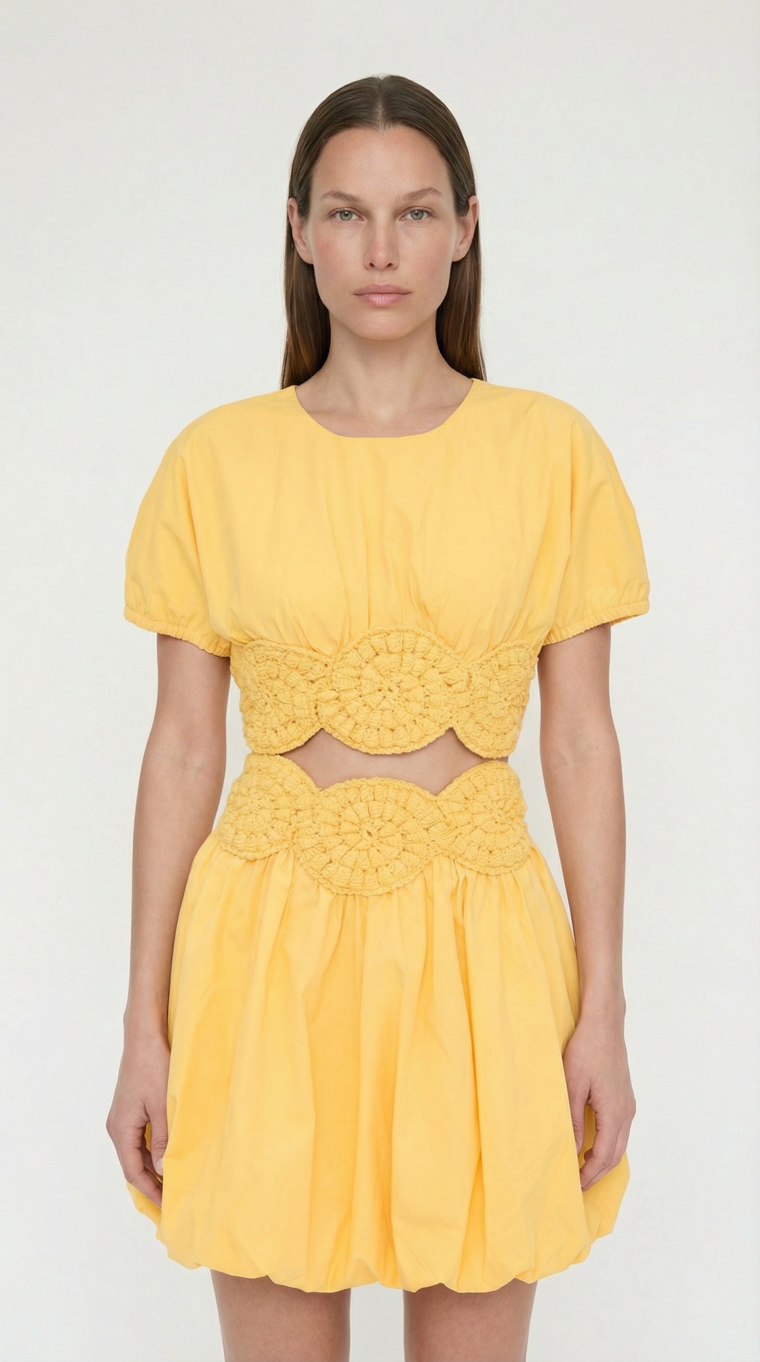 Front view of Elexiay Amara Top in yellow featuring a cotton poplin bodice, crew neck, and intricate white crochet trim at the hem.