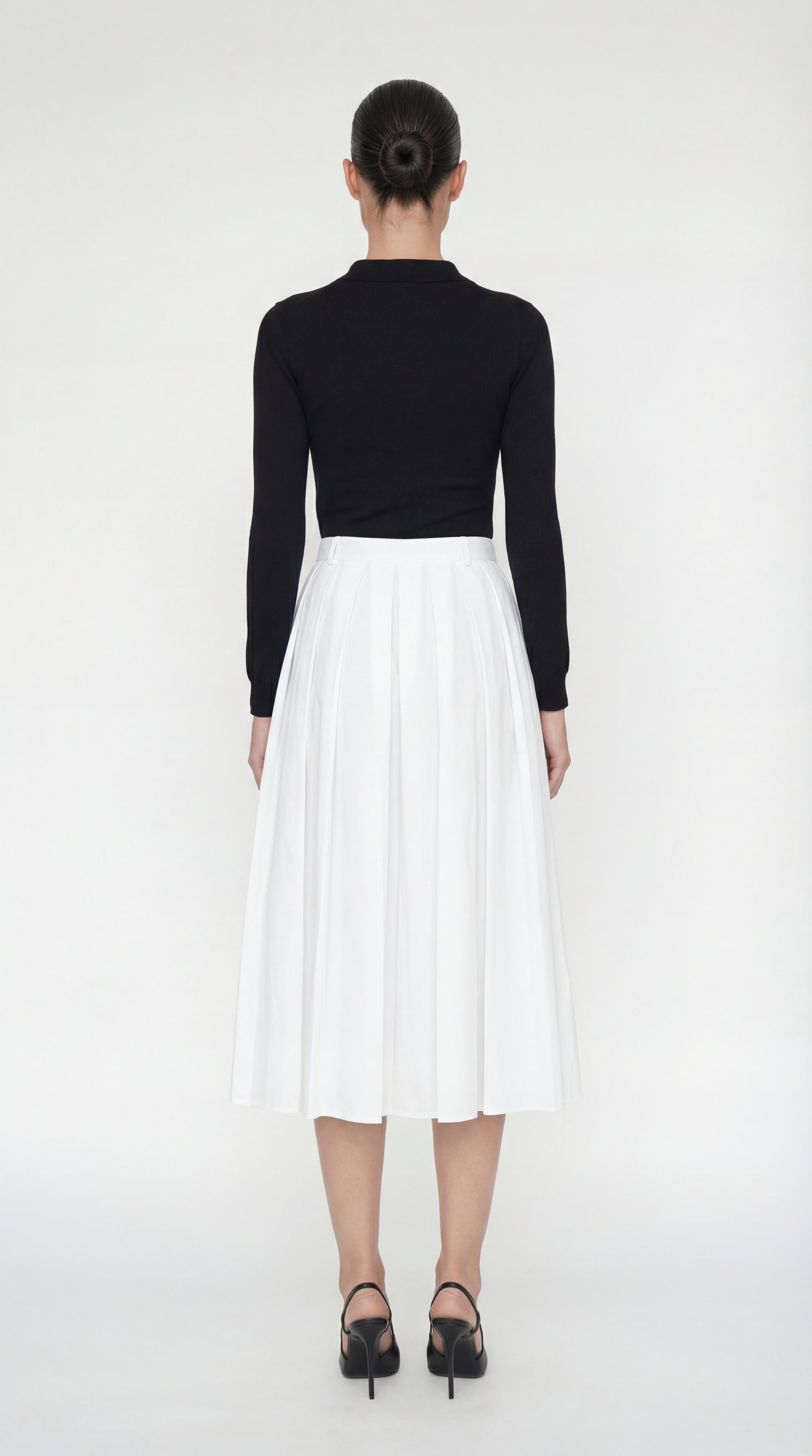The back of the Sonia Dress showing the seamless transition from the fitted knit top to the voluminous white skirt.