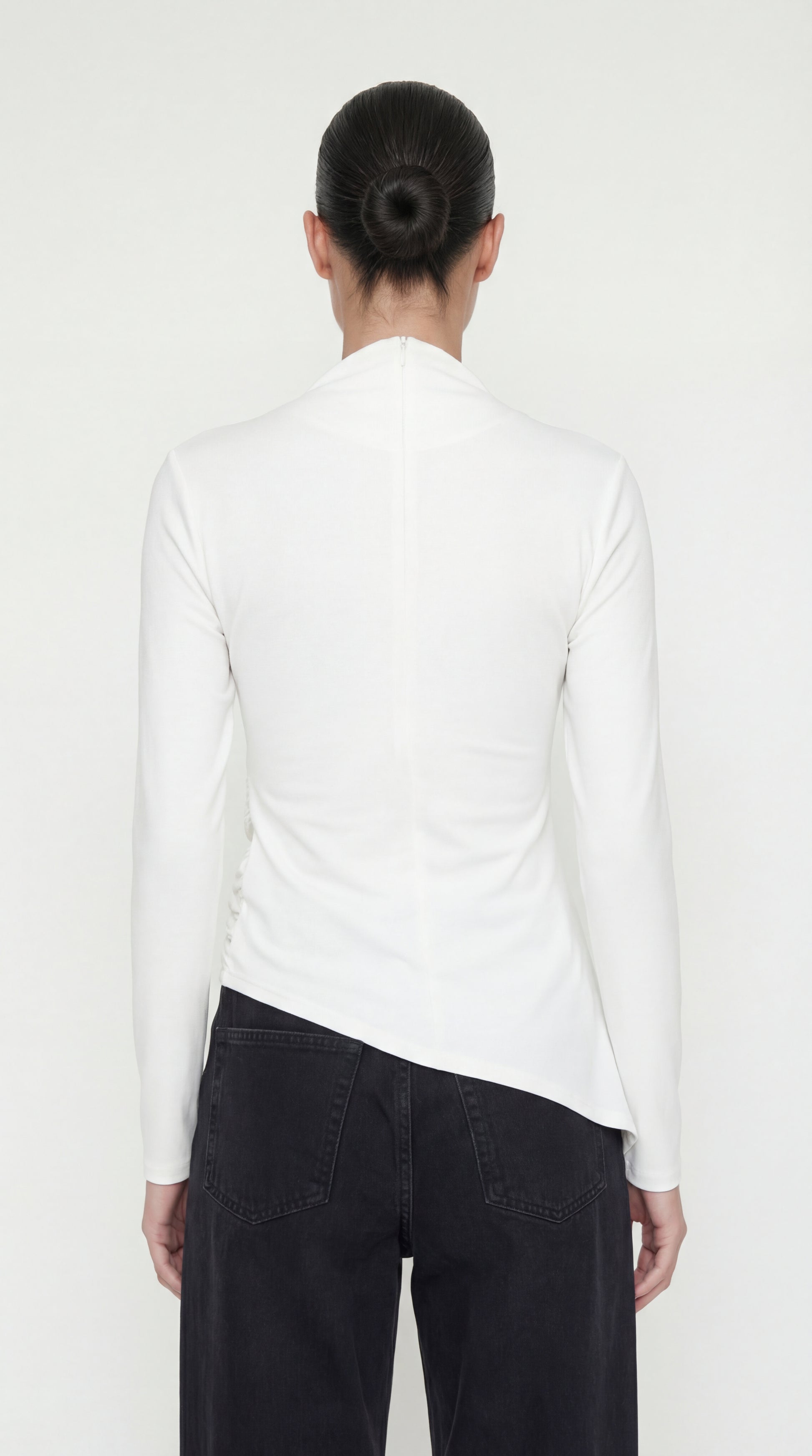 The back of the Toni Shirt showing the sleek mock neck and a hidden zipper closure for a seamless fit.
